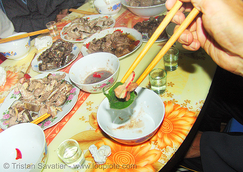 dog meat dinner - eating a bit in a leaf - thịt ch&oacute; - vietnam
