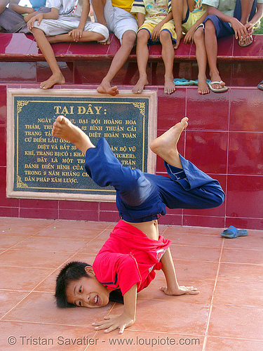 kid break-dancing - vietnam, boys, break dance, break dancing, children, communism, kids, memorial, monument, phan thiet, victory