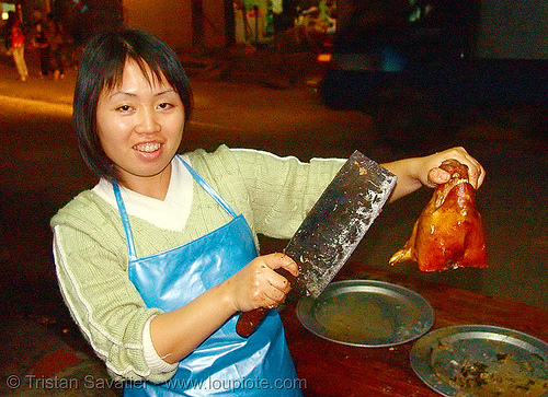 roasted piglet head - should i cut it for you? - vietnam, asian woman, cooked, food, lang sơn, meat, merchant, night, pig head, pork, roasted pig, roasted piglet, vendor